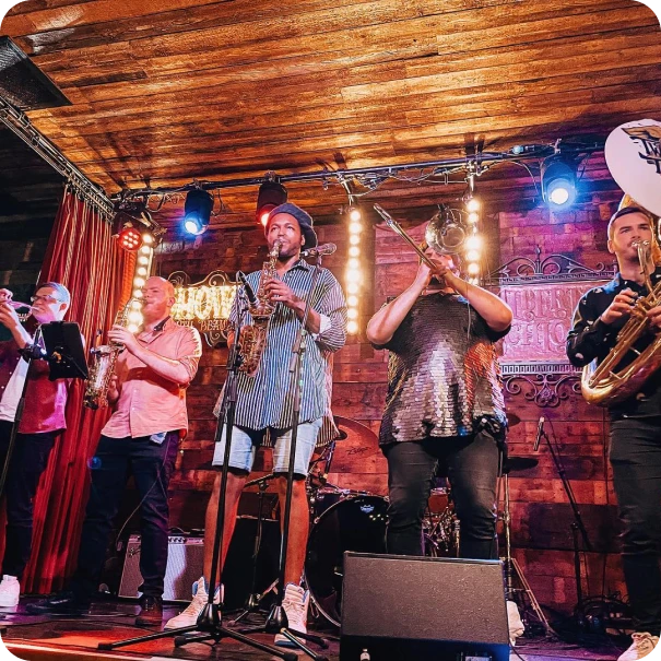 A band on stage playing brass instruments