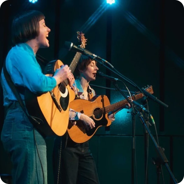 A duo performing on stage
