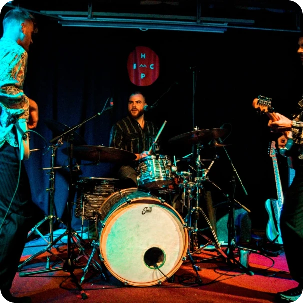 A trio performing on a stage