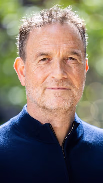 Headshot of male Gigpig founder with blurred background