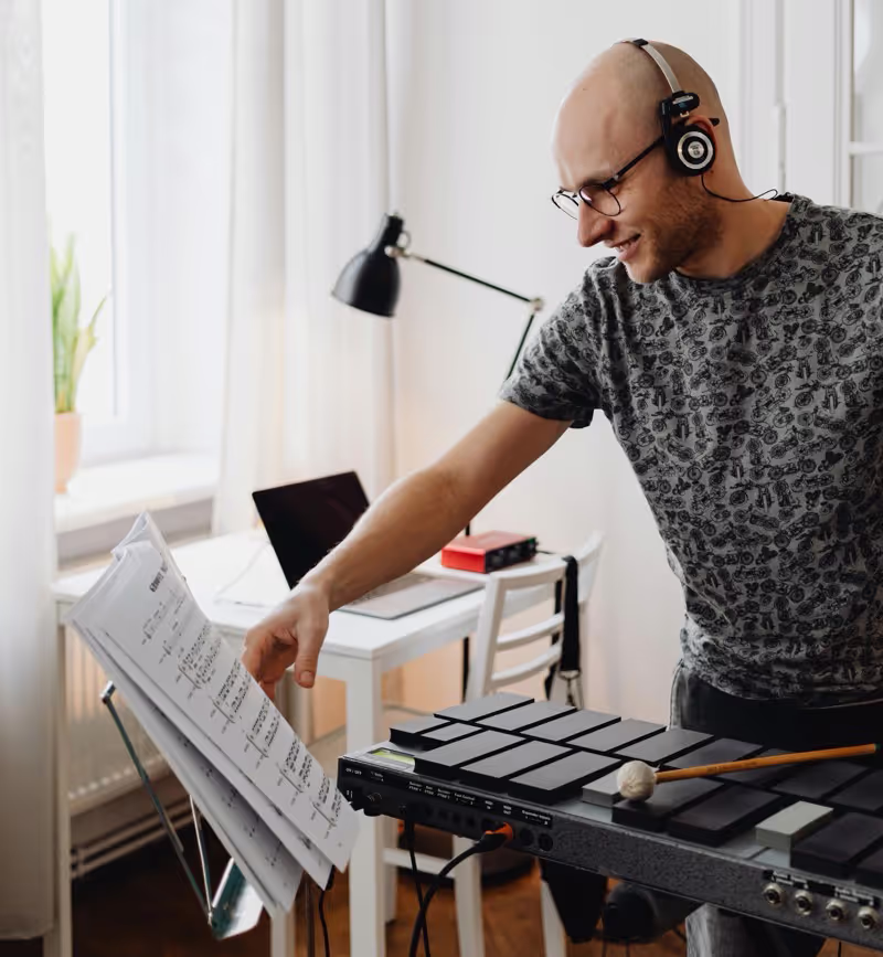 Male musician working at a keyboard