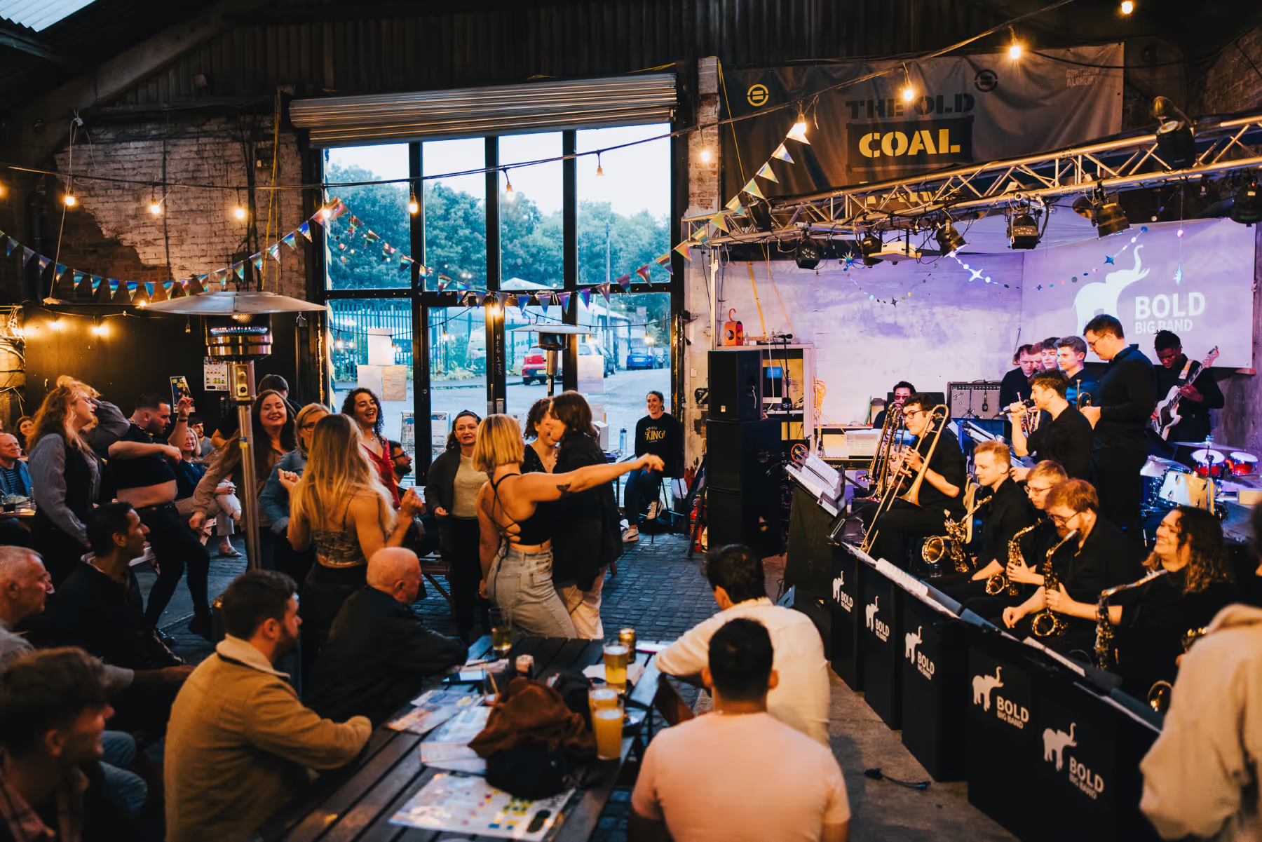 A group of people gathered at a music event, enjoying the live entertainment.