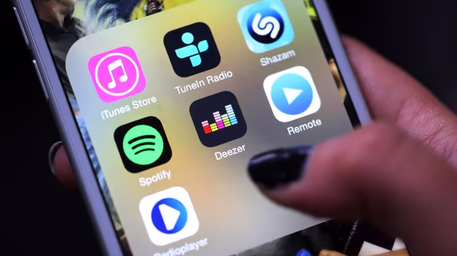 A woman holds her phone and is showcasing the downloaded apps