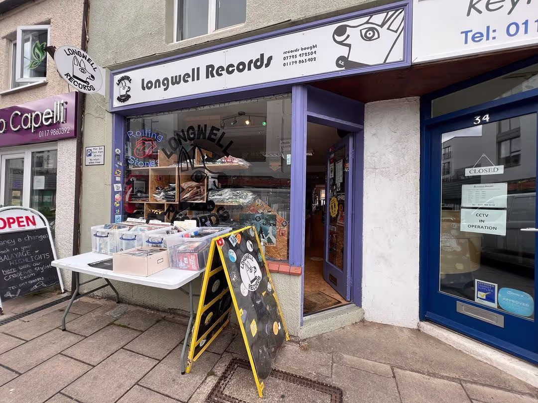 The exterior of a store displaying a prominent sign that states "Longwel Records," welcoming visitors