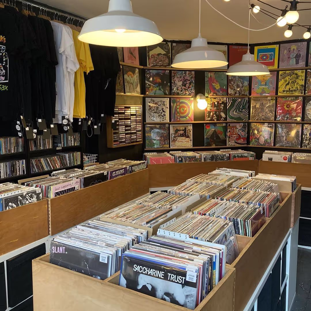 The exterior of a store displaying a prominent sign that states "Longwel Records," welcoming visitors