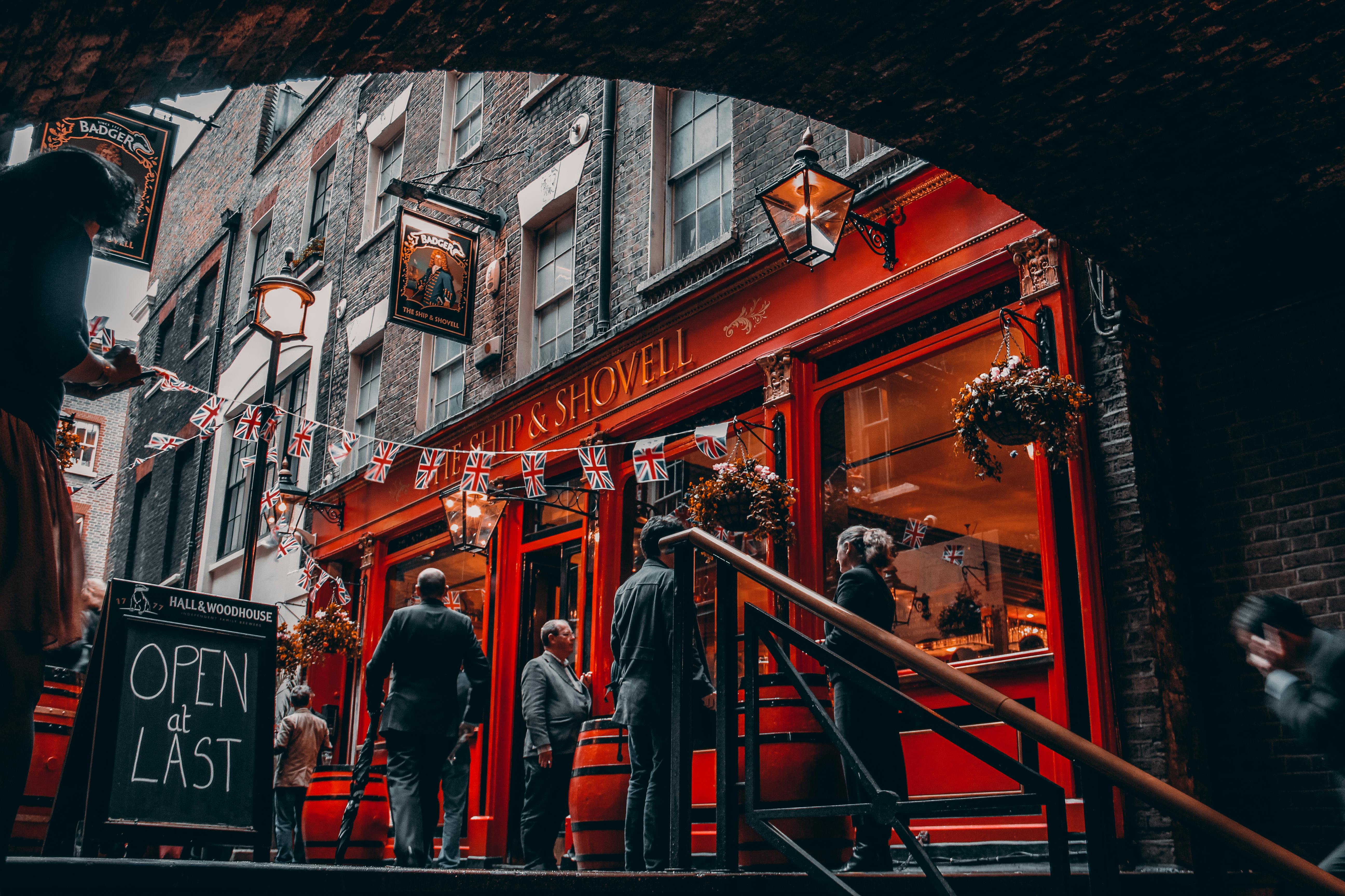 People outside a pub in the UK 