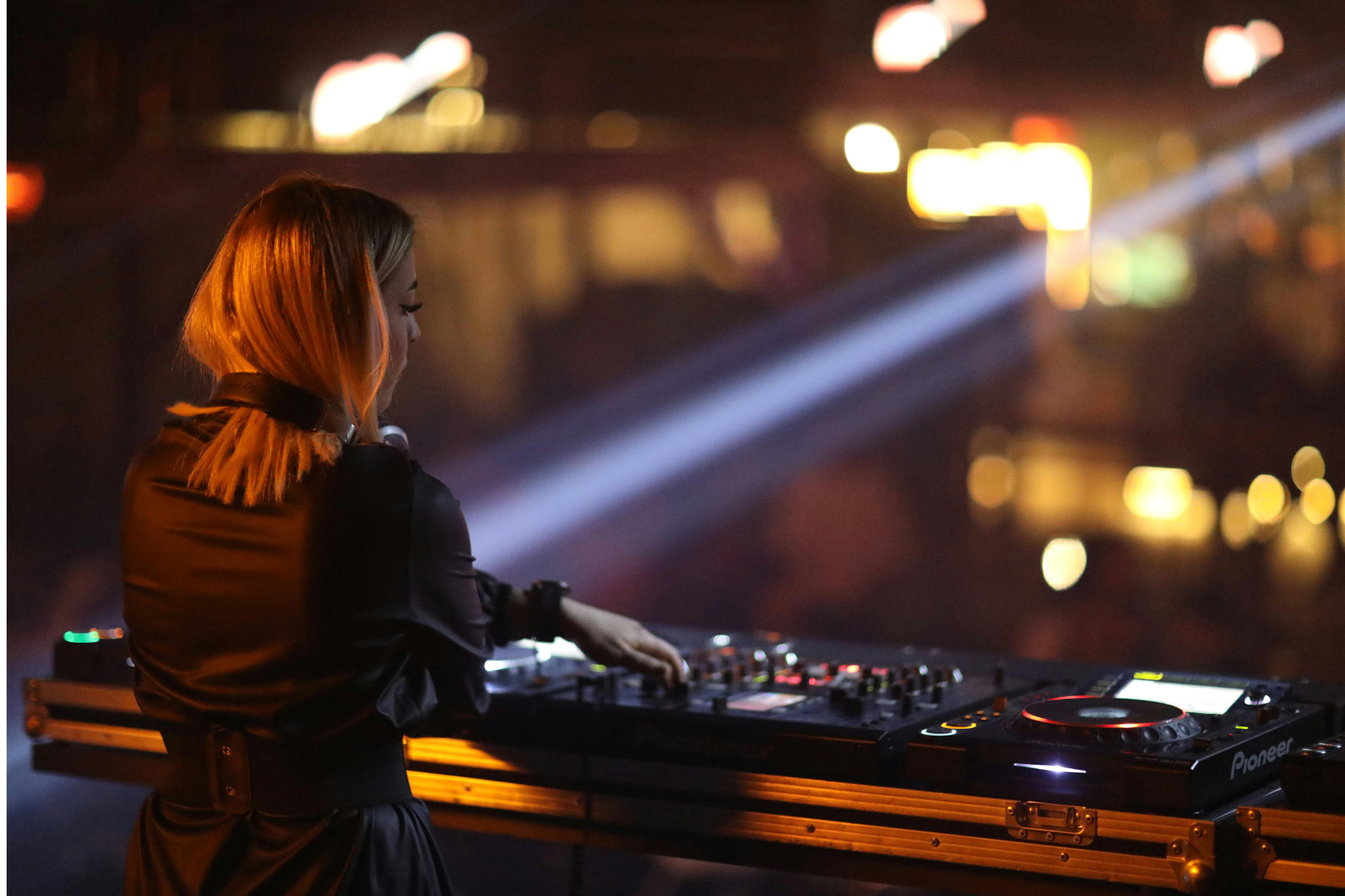 female dj performing on stage