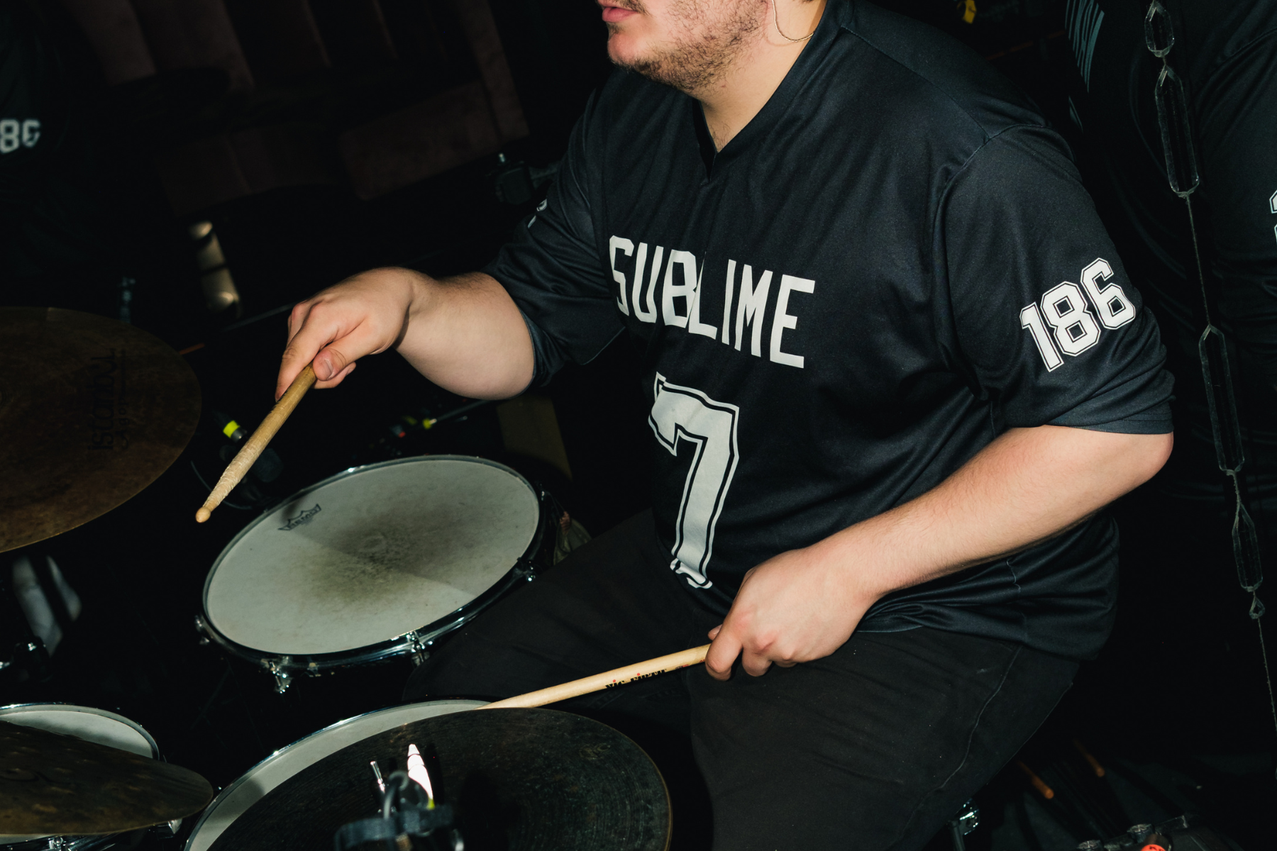 Drummer with Octo Finance Logo