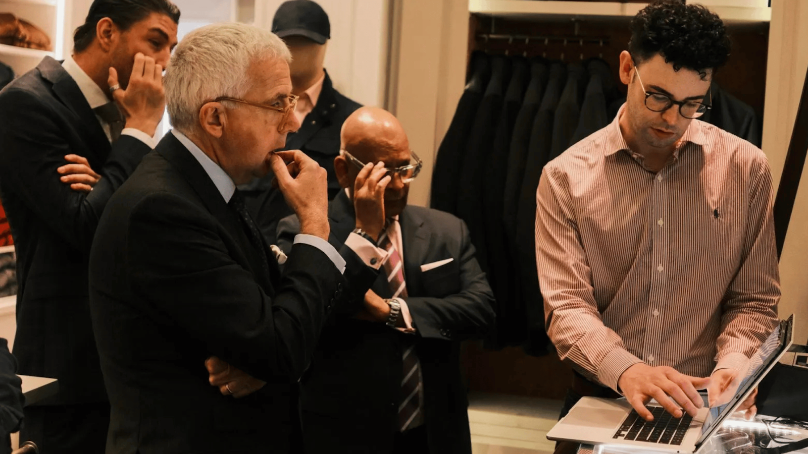 Kubix team reviewing performance insights together on a laptop during an in-person eCommerce working session.