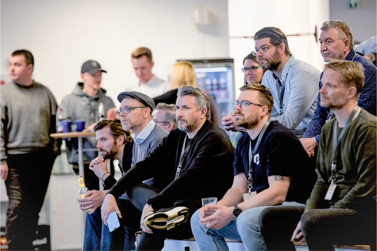 people listening to a speaker event