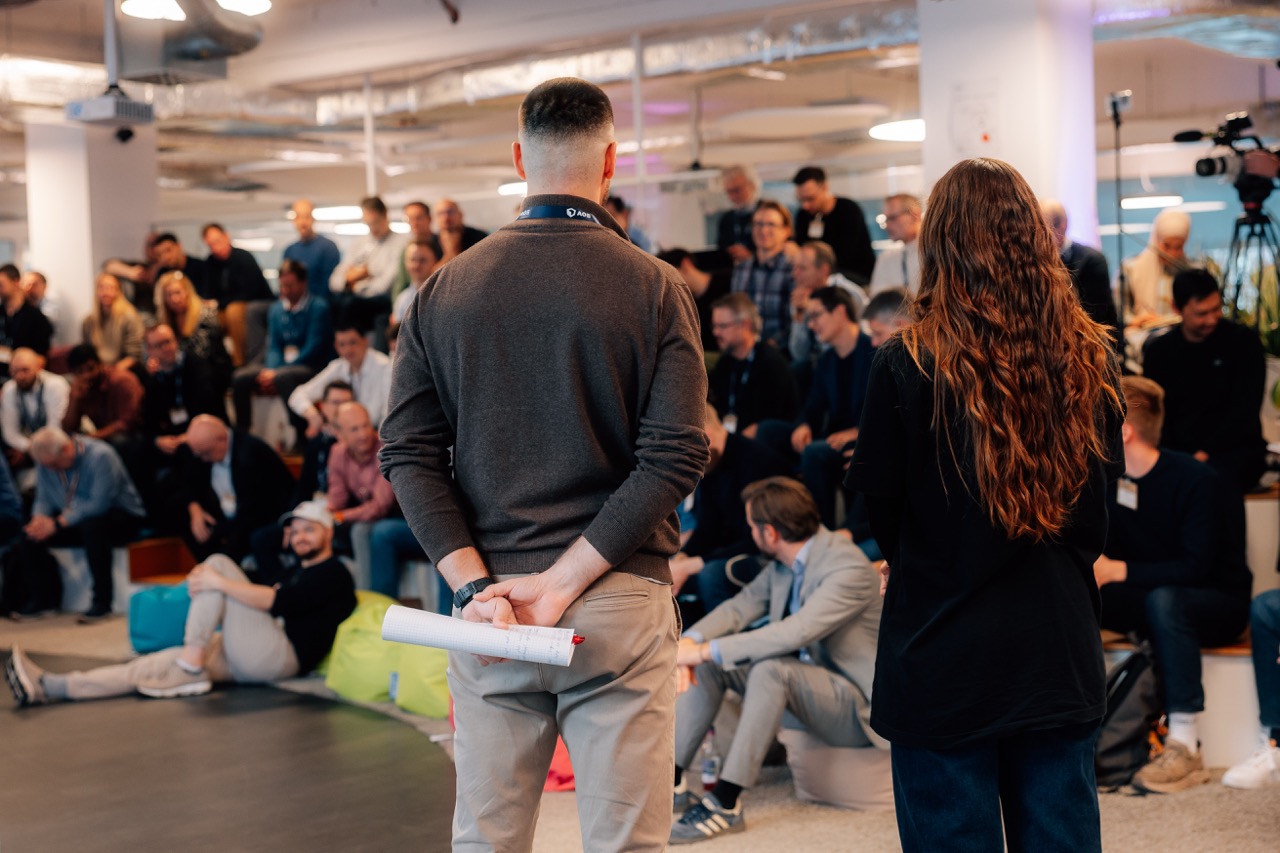 people talking at event