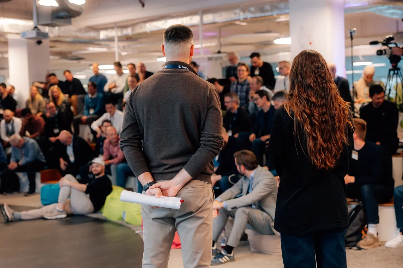 people talking at event