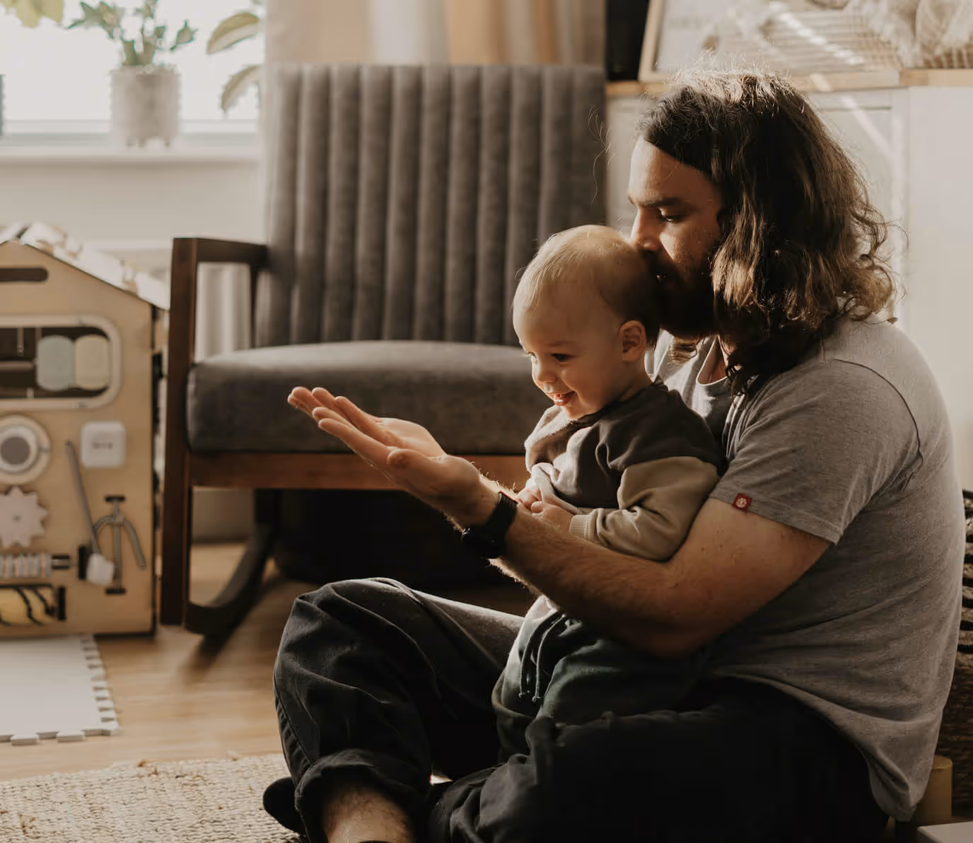 Father and son sitting down the floor
