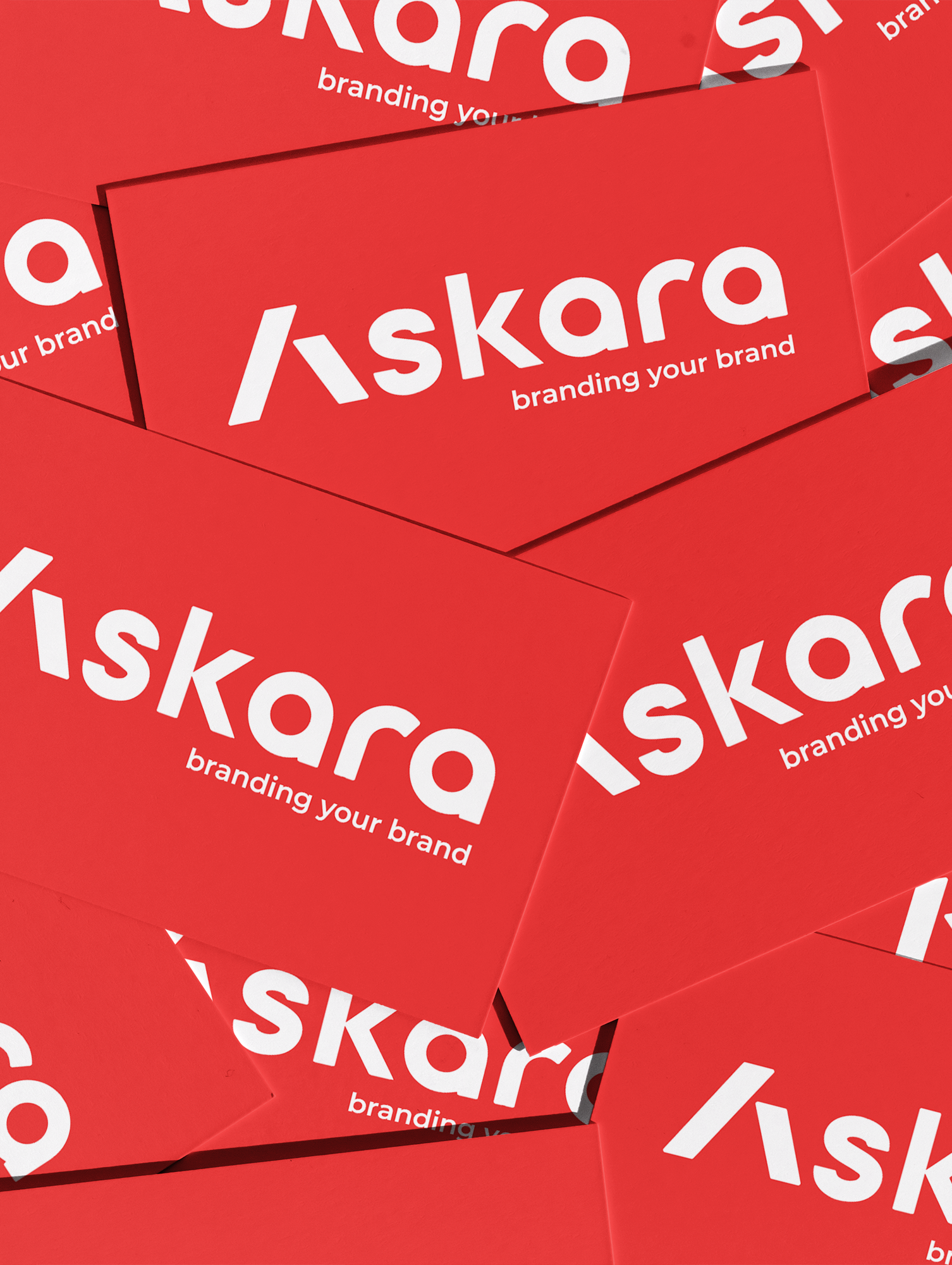 Rote Visitenkarten der Askara Marketing GmbH Dresden mit dem Markenslogan „branding your brand" – Branding Agentur Dresden