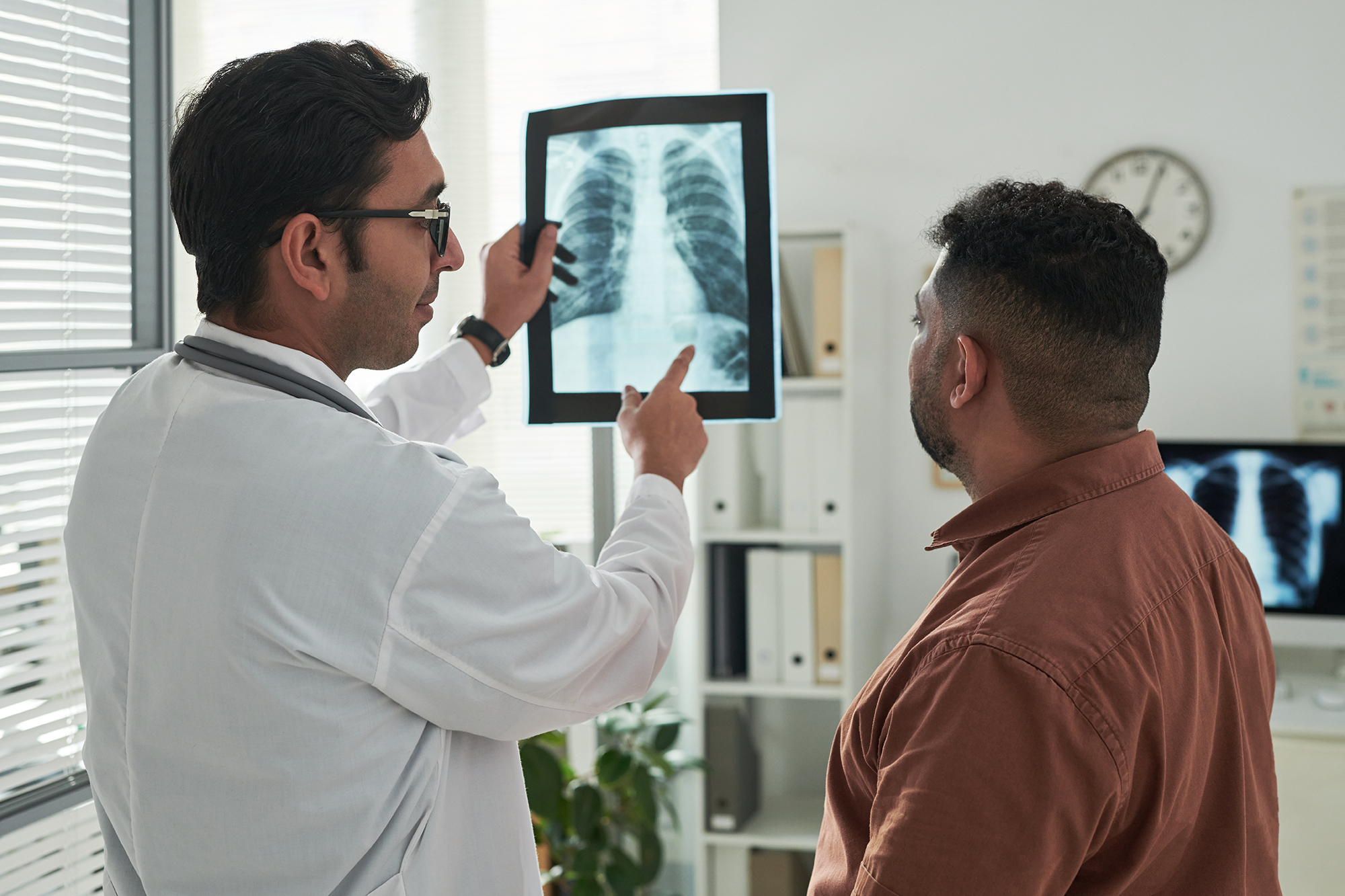 Patient and doctor looking at XRay