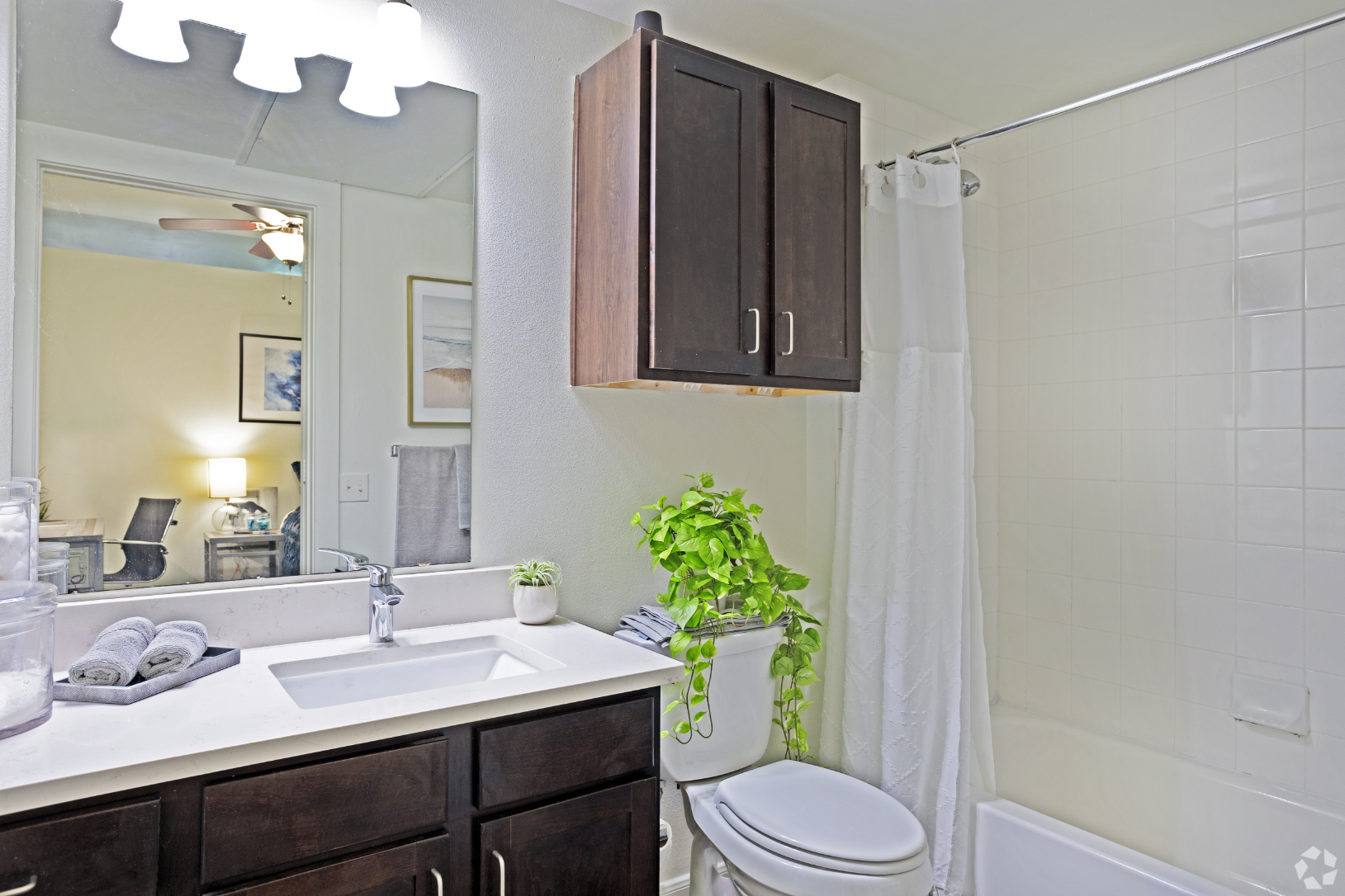 Bathroom with vanity and shower tub combo