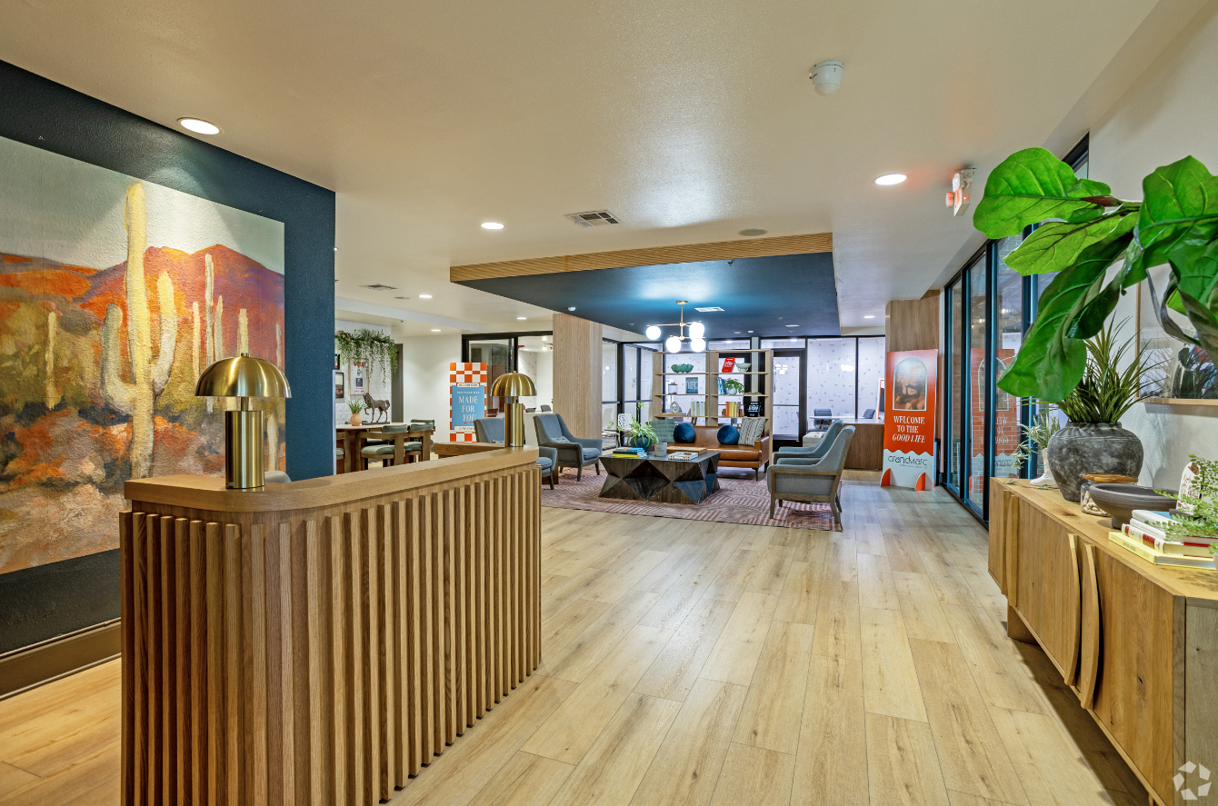 Front lobby with desk and view into lounge with seating