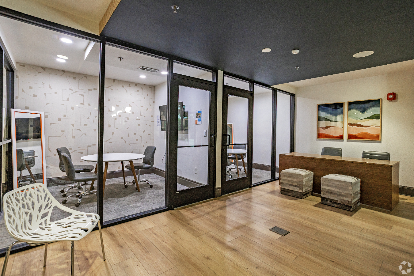 View into Study rooms with tables, chairs, and desks