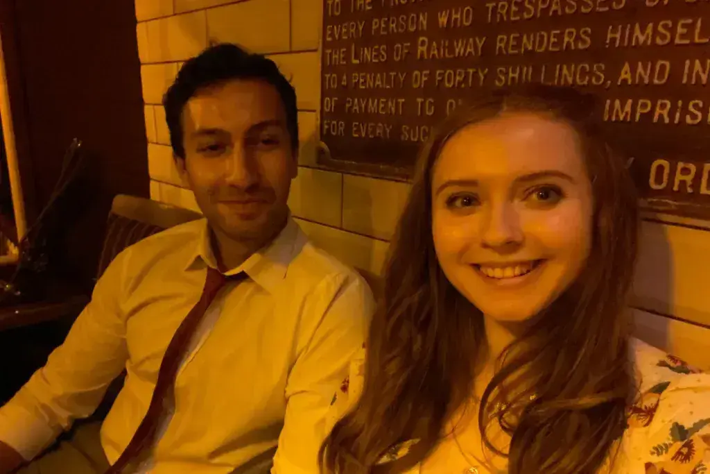 man and woman smiling at camera