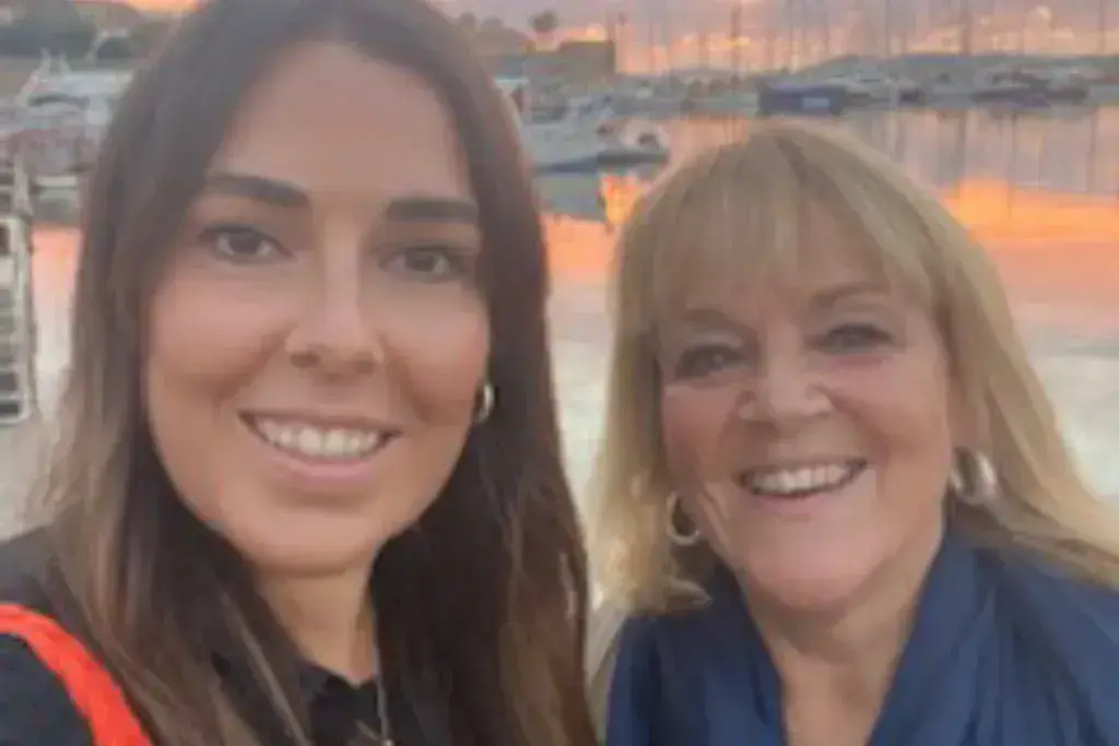 two women smiling at the camera