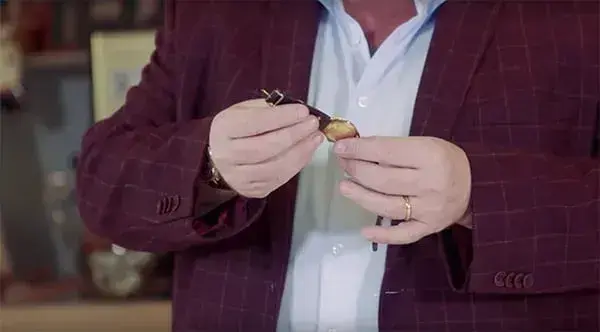 Antony Charman appraising a vintage Omega watch