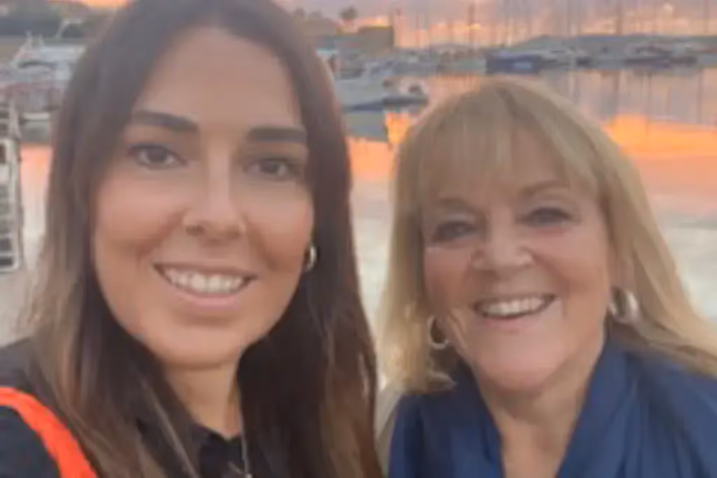 two women smiling at the camera