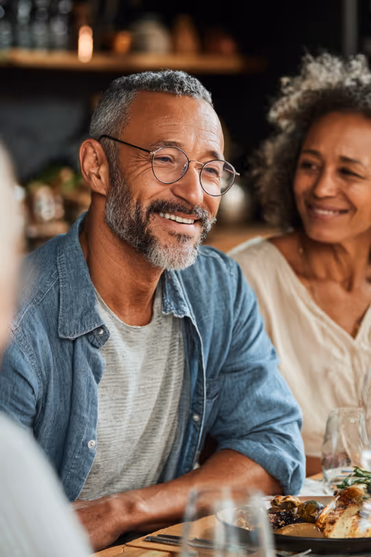 Man with his family at a dinner table