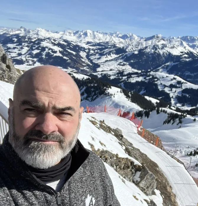 Norm Auger III outdoors in the mountains