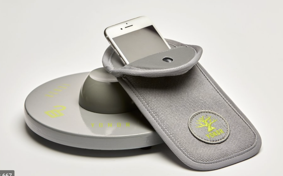 Yondr phone pouch and locking base used to secure student phones