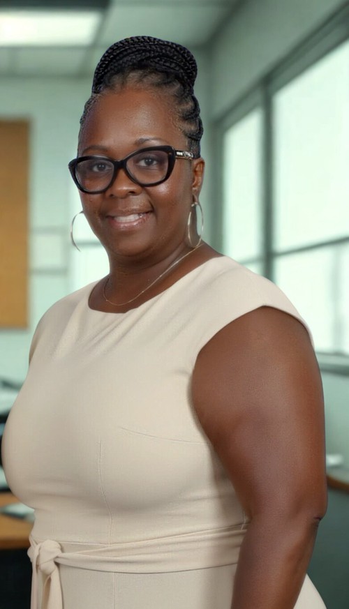 Yolanda Lawrence smiling in professional attire at school office