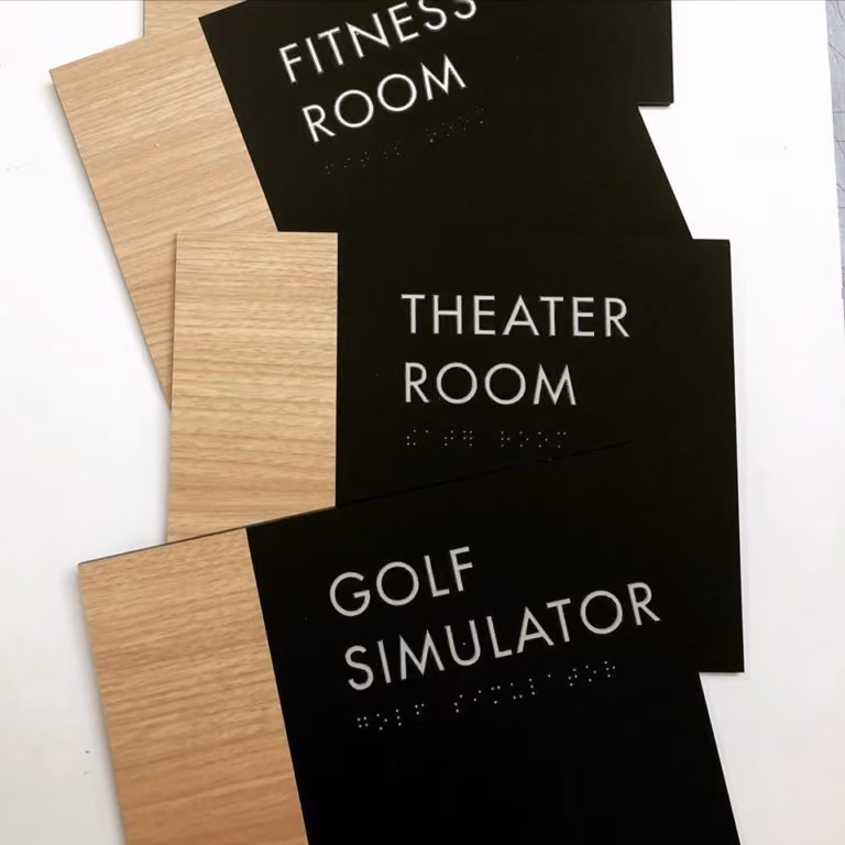 Accessible amenities signs made of wood laminate and black acrylic