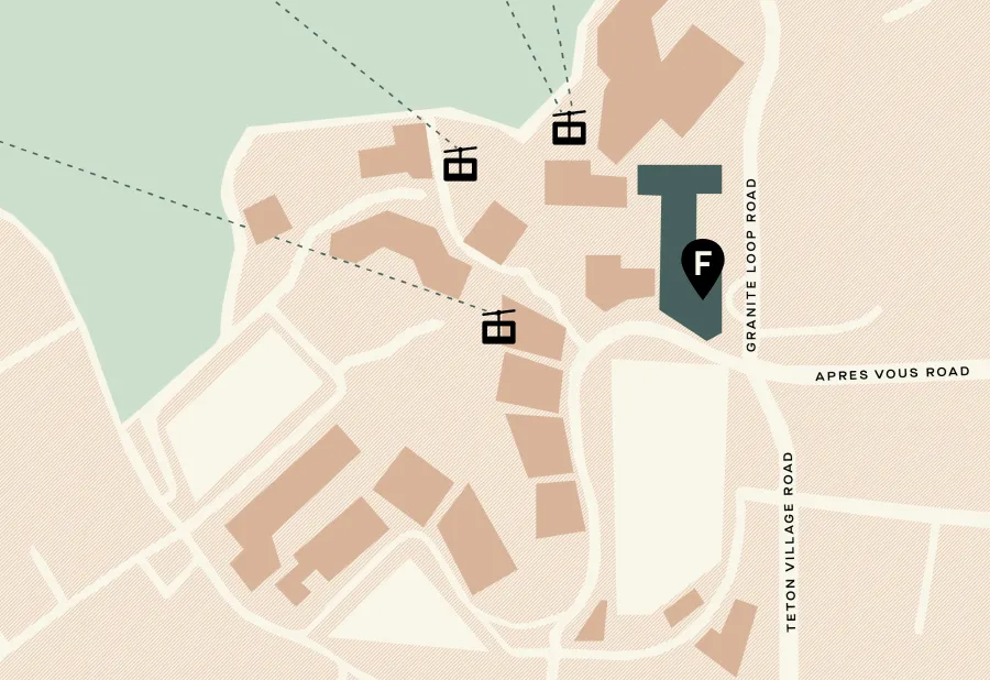 Simplified map showing buildings, roads, and a parking icon marked F near Granite Loop Road in a village area.
