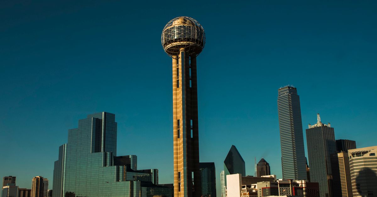 Dallas skyline with Reunion Tower under a clear blue sky