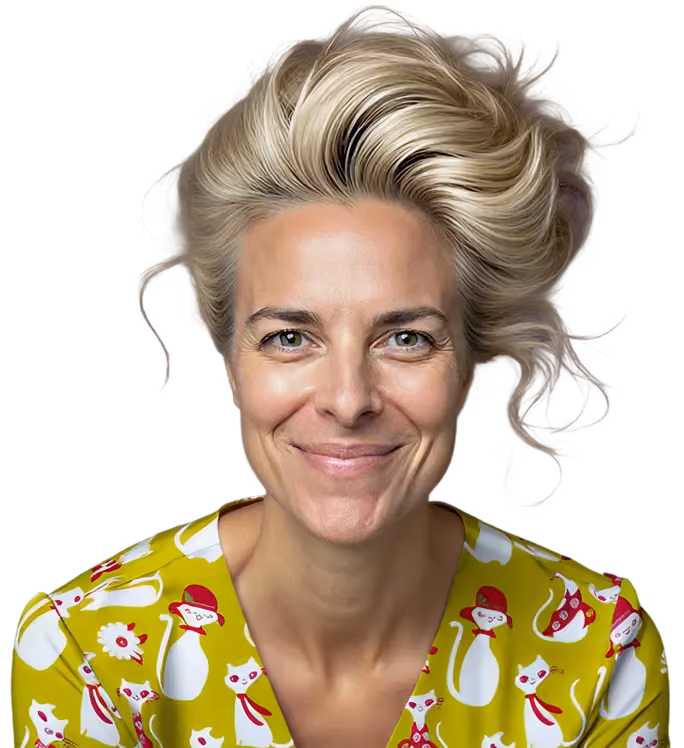 Smiling woman with light blonde hair styled upwards wearing a yellow top patterned with white and red cartoon cats.