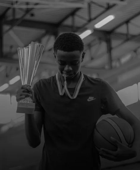 A man is holding a trophy