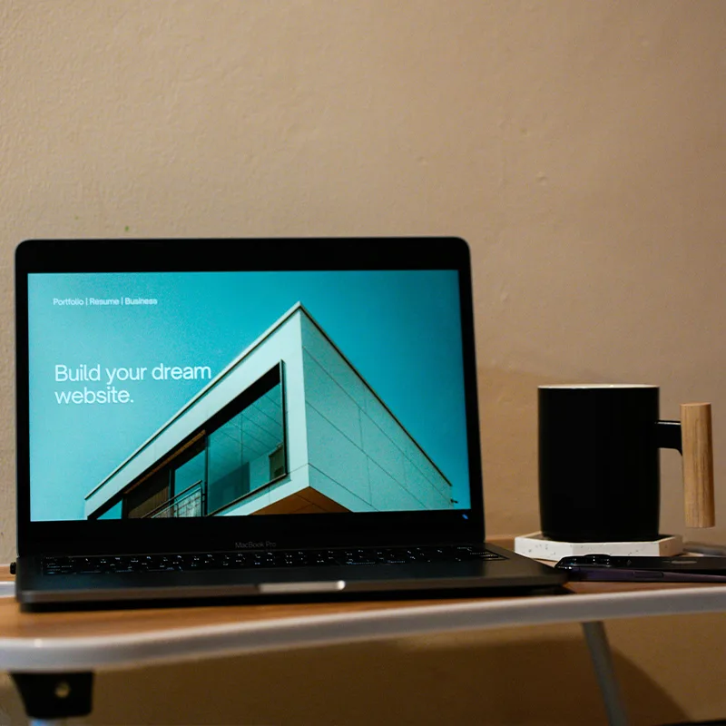 Computer monitor and accessories on a stylish modern desk.