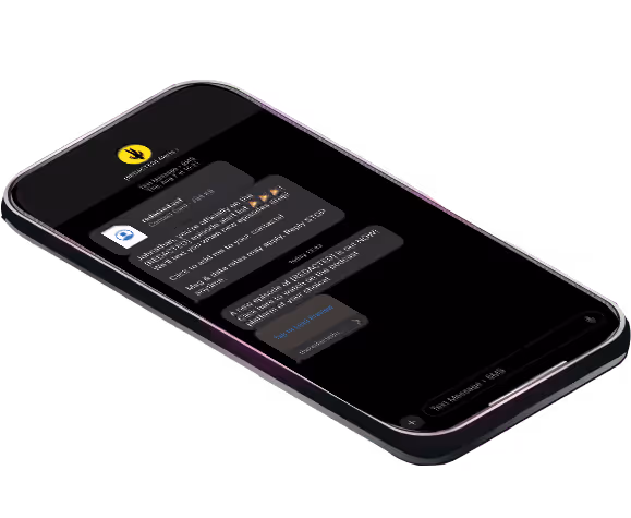 Smartphone displaying a dark-themed chat conversation with text messages and emojis.