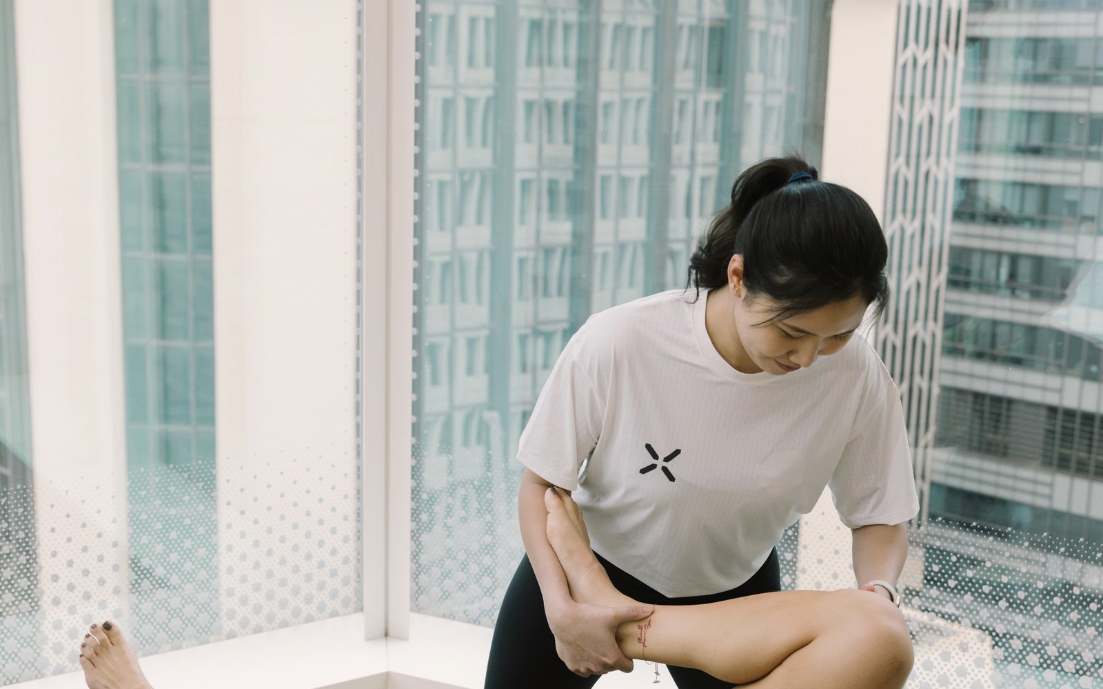 A PHYX therapist helps a patient