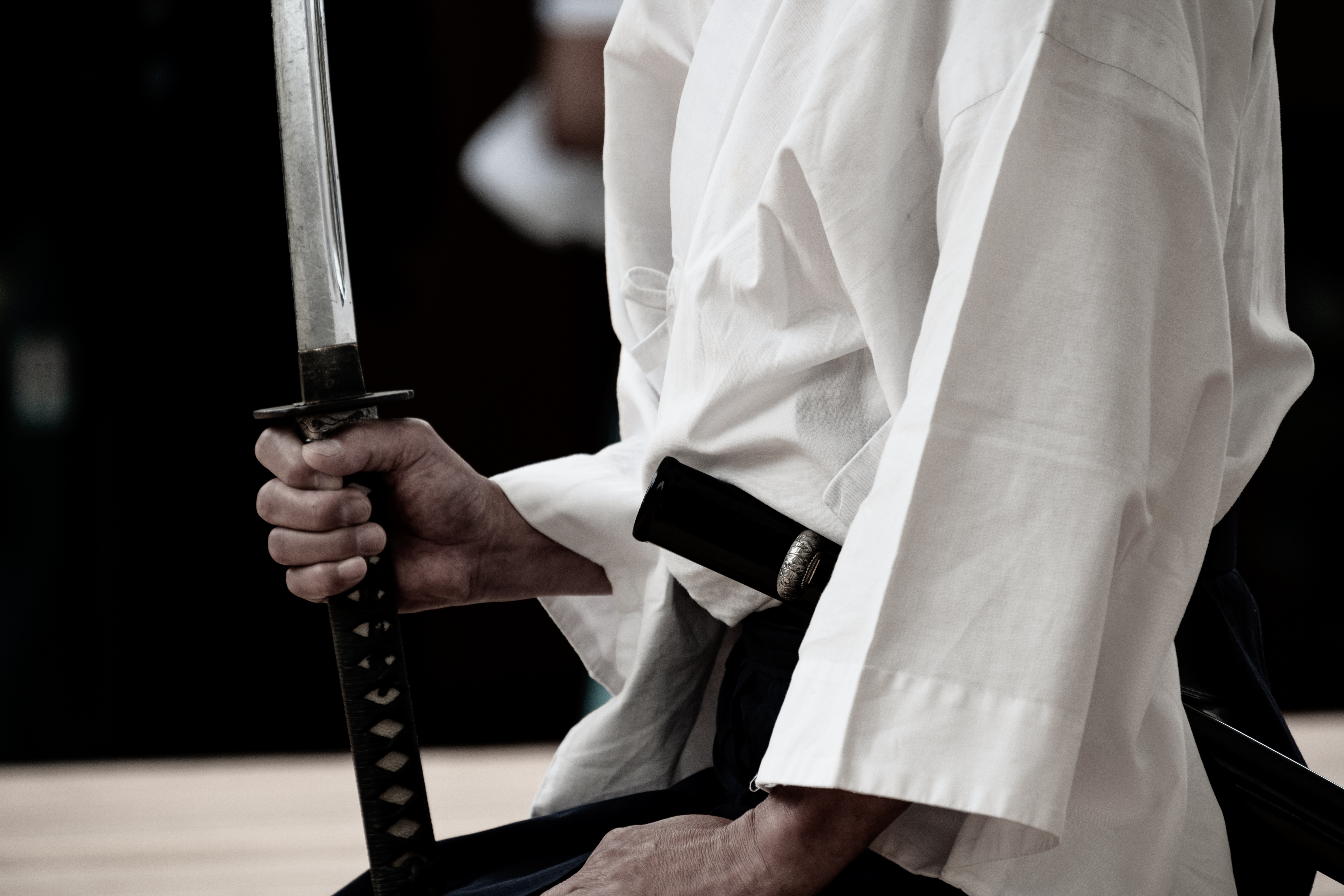 Discipline — swordsman in white training clothes