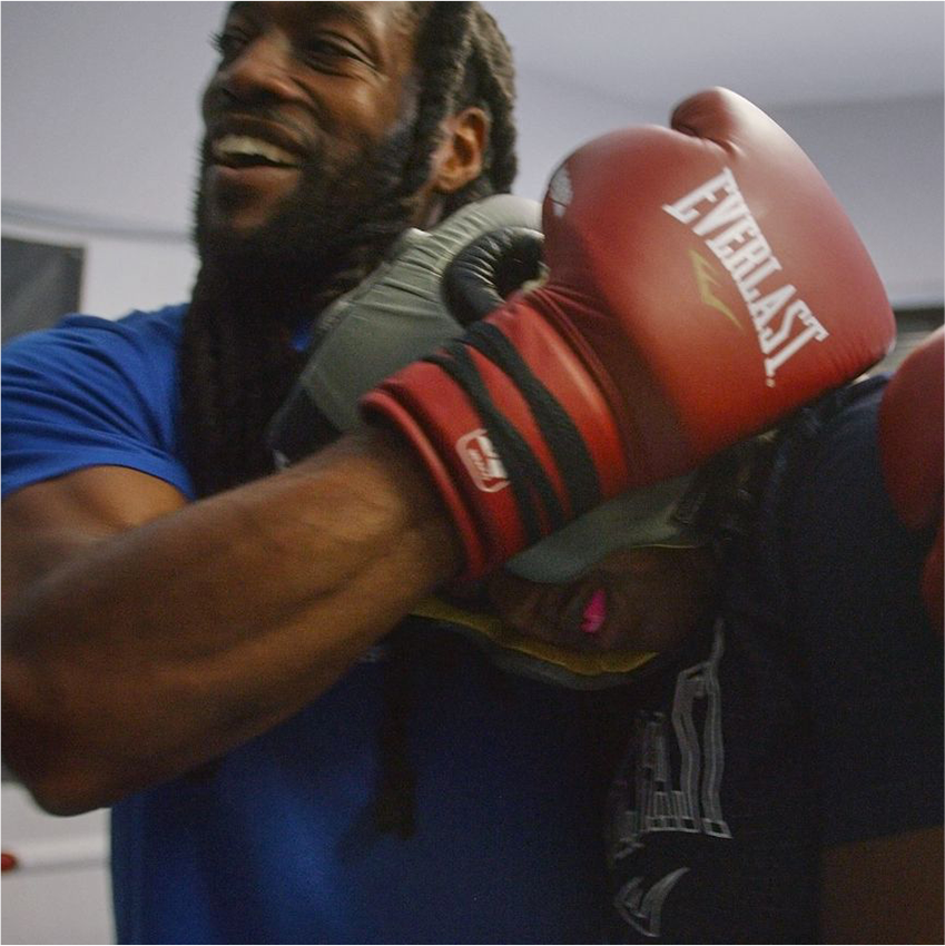 Trainer with boxing gloves