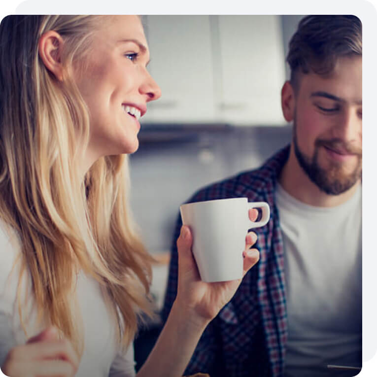 A young couple enjoying their comfortable kitchen at home