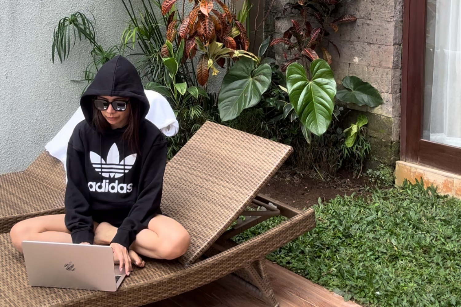 Remote work setup in a Bali villa, balancing wellness and client tasks.