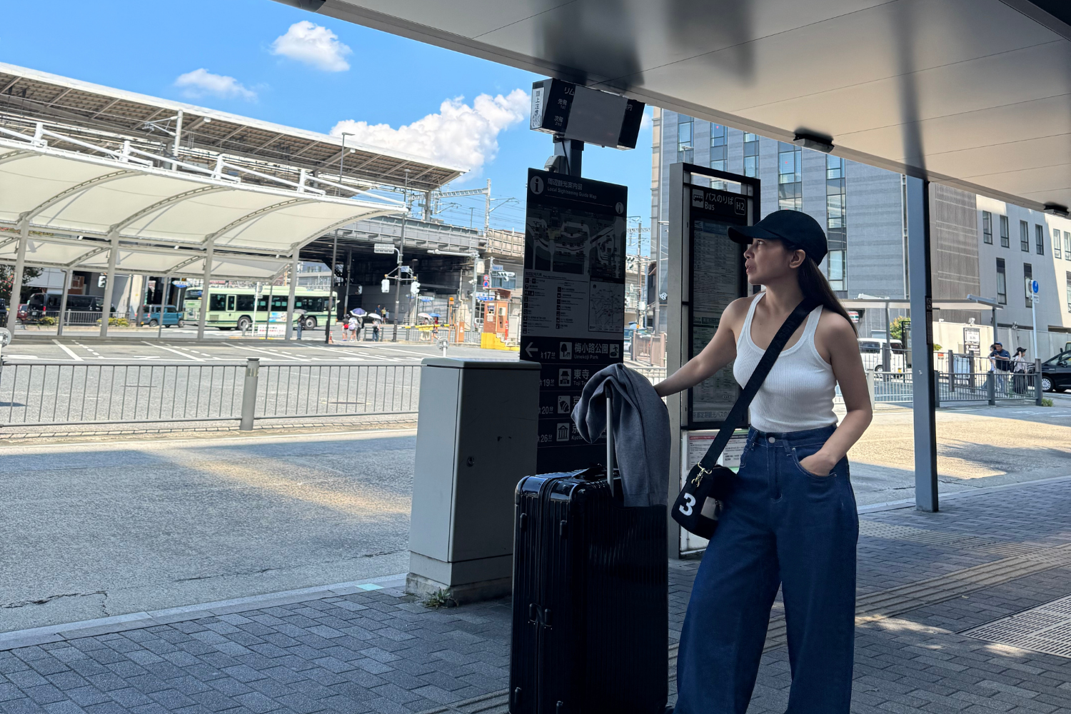Travelers waiting at Kyoto Station for the Limousine Bus, capturing a real moment of the Japan journey.