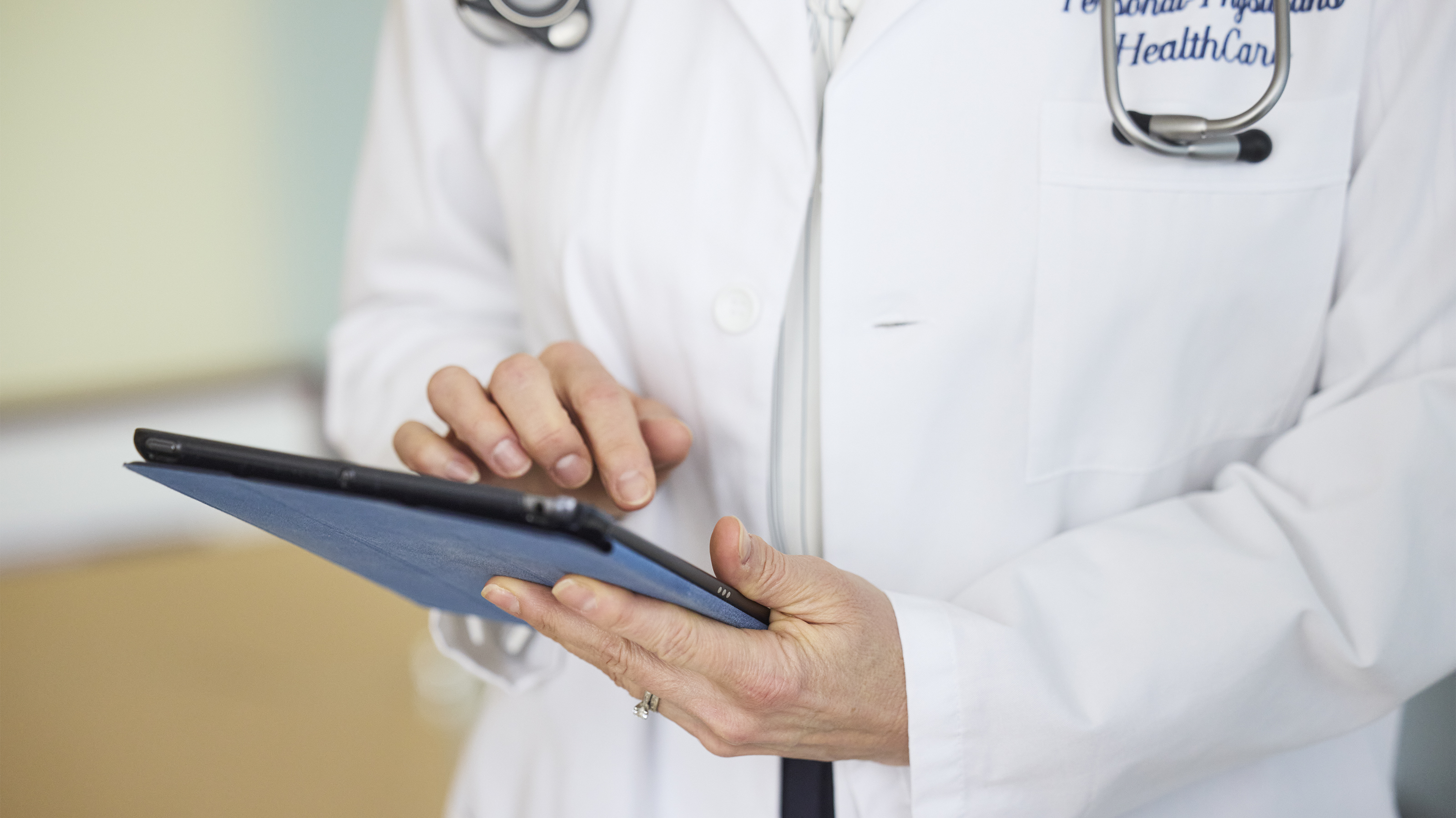 Nurse performing blood draw during medical testing.