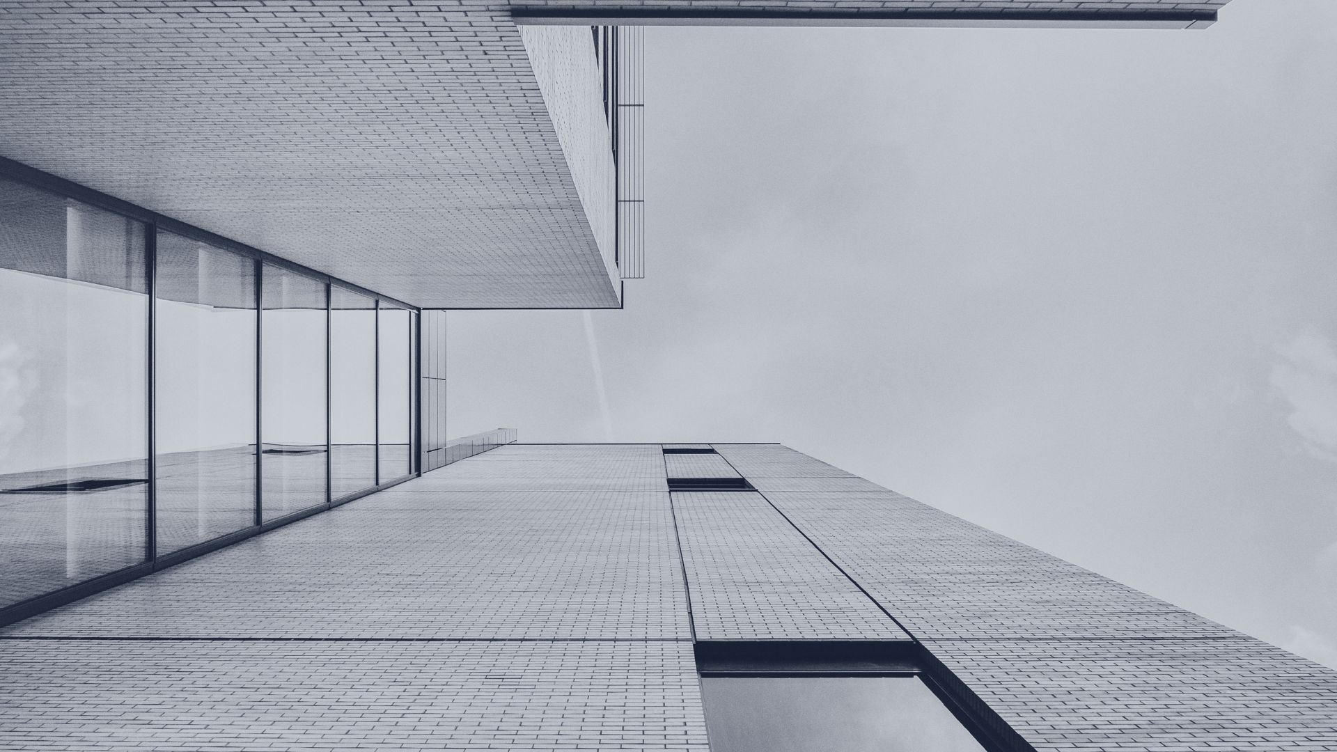 Looking up at a glass tower for a Delaware company formation guide