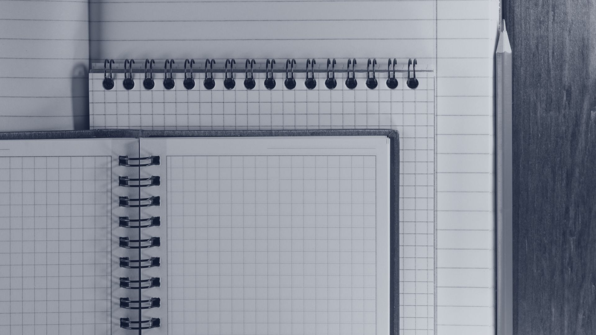 Spiral notebook and pen for a startup legal compliance guide