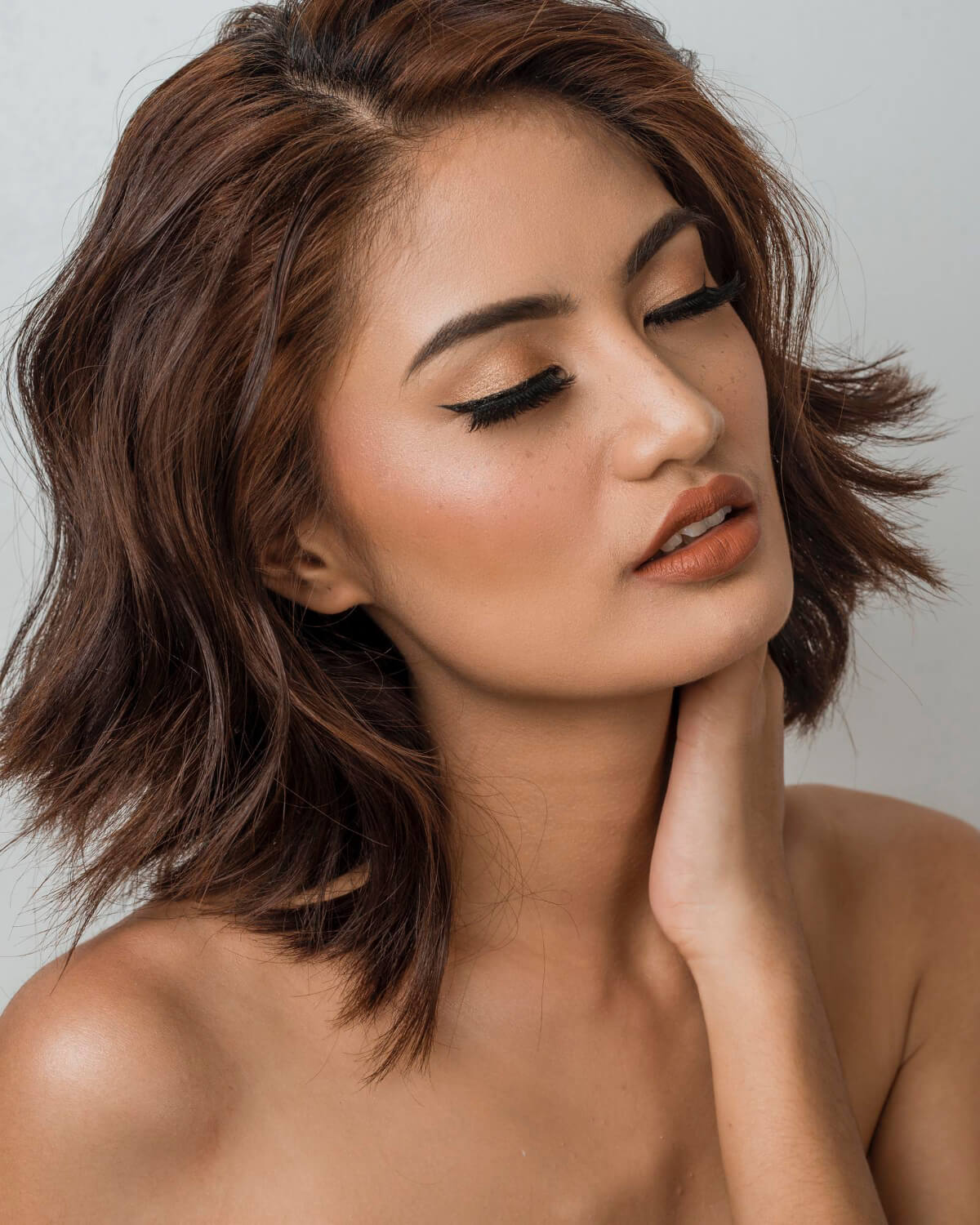 A woman with closed eyes.