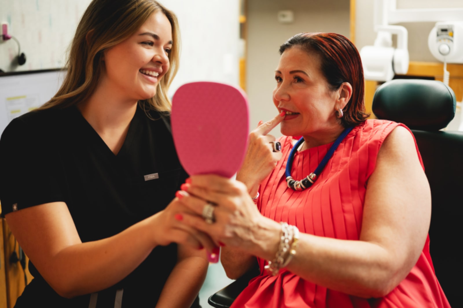 Female dentist discussing treatment plan with patient, showing collaborative care approach