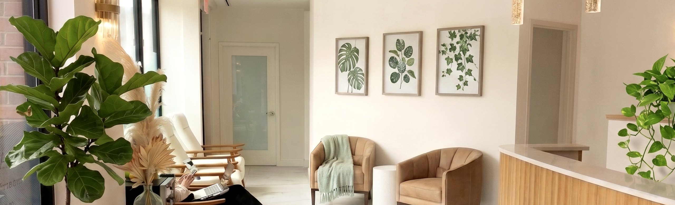 The Materna Healthcare waiting room in the West Village with armchairs, plants, and botanical prints