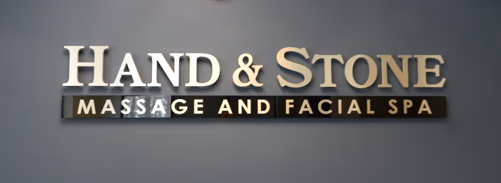 Acrylic dimensional letters mounted on standoffs above an acrylic panel